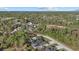 Overhead shot of beautiful home, featuring a nice roof and surrounded by trees at 3049 Seth Rd, North Port, FL 34288