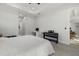 Bright bedroom featuring a work area, keyboard, ceiling fan, and neutral decor at 3049 Seth Rd, North Port, FL 34288