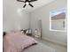 Bright bedroom with a comfortable bed, desk, ceiling fan, and a large mirror at 3049 Seth Rd, North Port, FL 34288