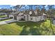 Aerial view of the charming single-Gathering home, featuring a well-manicured lawn at 3049 Seth Rd, North Port, FL 34288