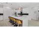 Bright kitchen boasts an oversized island with breakfast bar and pendant lighting at 3049 Seth Rd, North Port, FL 34288