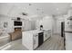 Kitchen island overlooks the electric fireplace, living room and dining area at 3049 Seth Rd, North Port, FL 34288