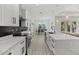 Bright kitchen with an island overlooking the dining room and living spaces at 3049 Seth Rd, North Port, FL 34288