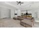 Open living room with a modern sectional, recessed lighting, and ceiling fan at 3049 Seth Rd, North Port, FL 34288
