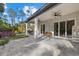 Relaxing covered patio with ceiling fans, overlooking the backyard at 3049 Seth Rd, North Port, FL 34288