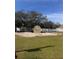 Large backyard with ample green space and a storage shed at 3289 Pellam Blvd, Port Charlotte, FL 33948
