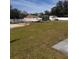 Spacious backyard with boat, multiple sheds and white vinyl privacy fence at 3289 Pellam Blvd, Port Charlotte, FL 33948