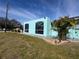 Home exterior with large arched windows and well-maintained lawn at 3289 Pellam Blvd, Port Charlotte, FL 33948