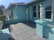 Turquoise home exterior showcasing a tiled entry and manicured landscaping with statues at 3289 Pellam Blvd, Port Charlotte, FL 33948
