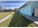 A well-maintained home exterior with a manicured lawn and walkway at 3289 Pellam Blvd, Port Charlotte, FL 33948
