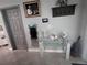 Hallway with neutral paint, decor and a mirror next to the doorway at 3289 Pellam Blvd, Port Charlotte, FL 33948