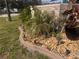Landscaped garden bed with attractive statue and rock cover for low maintenance at 3289 Pellam Blvd, Port Charlotte, FL 33948