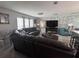 Cozy living room with plush seating, a modern stone wall, and ample natural light at 3289 Pellam Blvd, Port Charlotte, FL 33948