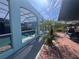 Outdoor pool and patio area with blue exterior and brick flooring at 3289 Pellam Blvd, Port Charlotte, FL 33948
