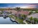 Beautiful waterfront property featuring a private dock, screened-in patio, and lush landscaping at 3321 Tripoli Blvd, Punta Gorda, FL 33950