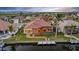 Stunning waterfront residence featuring private boat dock, screened-in patio, and manicured backyard at 3321 Tripoli Blvd, Punta Gorda, FL 33950