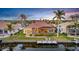 Lovely waterfront home featuring a private dock, screened-in lanai, and lush surroundings at 3321 Tripoli Blvd, Punta Gorda, FL 33950