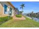 Expansive waterfront property with manicured lawn and screened lanai for outdoor living at 3321 Tripoli Blvd, Punta Gorda, FL 33950