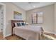 Bright bedroom with an area rug, a window with a view, and an art piece on the wall at 3321 Tripoli Blvd, Punta Gorda, FL 33950