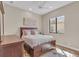 Cozy bedroom with a ceiling fan, area rug, a window and an art piece on the wall at 3321 Tripoli Blvd, Punta Gorda, FL 33950