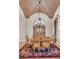 Elegant dining room featuring a decorative ceiling, ornate chandelier, and a floral rug at 3321 Tripoli Blvd, Punta Gorda, FL 33950