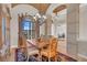 Elegant dining room with decorative ceiling, large window, and stone column at 3321 Tripoli Blvd, Punta Gorda, FL 33950