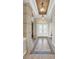 Elegant foyer with decorative tile flooring, high ceilings, and a chandelier, creating a grand entrance at 3321 Tripoli Blvd, Punta Gorda, FL 33950
