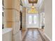 Grand foyer with decorative tiling, a hanging light fixture, and a white double door entry at 3321 Tripoli Blvd, Punta Gorda, FL 33950