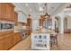 Well-equipped kitchen with stainless steel appliances, expansive island, and custom cabinetry at 3321 Tripoli Blvd, Punta Gorda, FL 33950