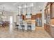 Open kitchen with a large center island, custom cabinetry, stainless steel appliances, and tile flooring at 3321 Tripoli Blvd, Punta Gorda, FL 33950