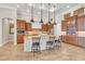Gourmet kitchen featuring custom cabinets, large island, and stainless steel appliances at 3321 Tripoli Blvd, Punta Gorda, FL 33950