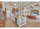 Spacious open kitchen with a center island and stainless appliances overlooking living room at 3321 Tripoli Blvd, Punta Gorda, FL 33950