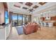Open concept living room featuring coffered ceilings, tile flooring and combined kitchen at 3321 Tripoli Blvd, Punta Gorda, FL 33950