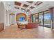 Inviting living room with entertainment center and sliding glass doors overlooking a backyard pool at 3321 Tripoli Blvd, Punta Gorda, FL 33950
