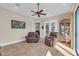 Living room featuring comfortable seating, tile flooring and a decorative display cabinet at 3321 Tripoli Blvd, Punta Gorda, FL 33950