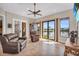 Spacious living room with tile flooring, ceiling fan, and a view of the waterfront at 3321 Tripoli Blvd, Punta Gorda, FL 33950