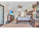 Spacious main bedroom featuring tray ceilings, an area rug, and TV for a relaxing retreat at 3321 Tripoli Blvd, Punta Gorda, FL 33950
