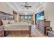 Large main bedroom with a tray ceiling, comfortable bed, and scenic views at 3321 Tripoli Blvd, Punta Gorda, FL 33950