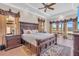 Spacious main bedroom with a tray ceiling, large bed, and water views at 3321 Tripoli Blvd, Punta Gorda, FL 33950