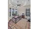 Home office featuring a tray ceiling, multiple windows, and a work space at 3321 Tripoli Blvd, Punta Gorda, FL 33950