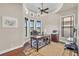 Home office featuring a tray ceiling, multiple windows, and a work space at 3321 Tripoli Blvd, Punta Gorda, FL 33950