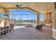 Covered patio with outdoor kitchen, dining, seating, and a pool overlooking waterfront at 3321 Tripoli Blvd, Punta Gorda, FL 33950