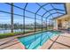 Screened-in pool and spa with paver deck overlooking waterfront view at 3321 Tripoli Blvd, Punta Gorda, FL 33950
