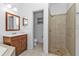 Bathroom featuring a single vanity, a toilet and an enclosed, tiled walk-in shower at 4504 Vaquero St, North Port, FL 34286