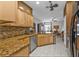 Inviting eat-in kitchen with granite countertops, tile backsplash, stainless appliances, and open to the living area at 4504 Vaquero St, North Port, FL 34286