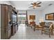 Spacious living room with sliding door access to the outside patio, comfortable seating, and entertainment center at 4504 Vaquero St, North Port, FL 34286