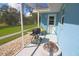 Cozy back porch area with grill, overlooking the backyard at 5131 Appomattox Dr, North Port, FL 34287