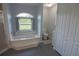 Serene bathroom featuring a soaking tub with a view and a separate shower at 5131 Appomattox Dr, North Port, FL 34287