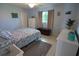 Comfortable bedroom with bright walls, ceiling fan, and closet storage at 5131 Appomattox Dr, North Port, FL 34287