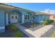 Inviting home entrance with double doors, arched windows, and a lovely landscaped walkway at 5131 Appomattox Dr, North Port, FL 34287
